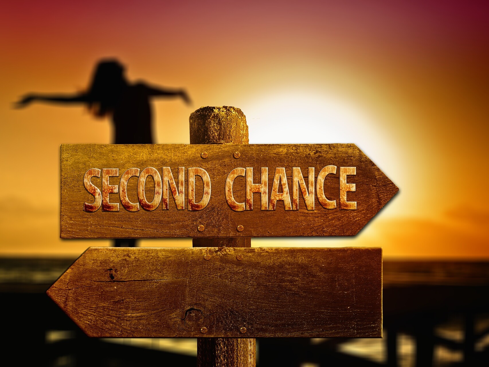 directional sign pointing to second chance