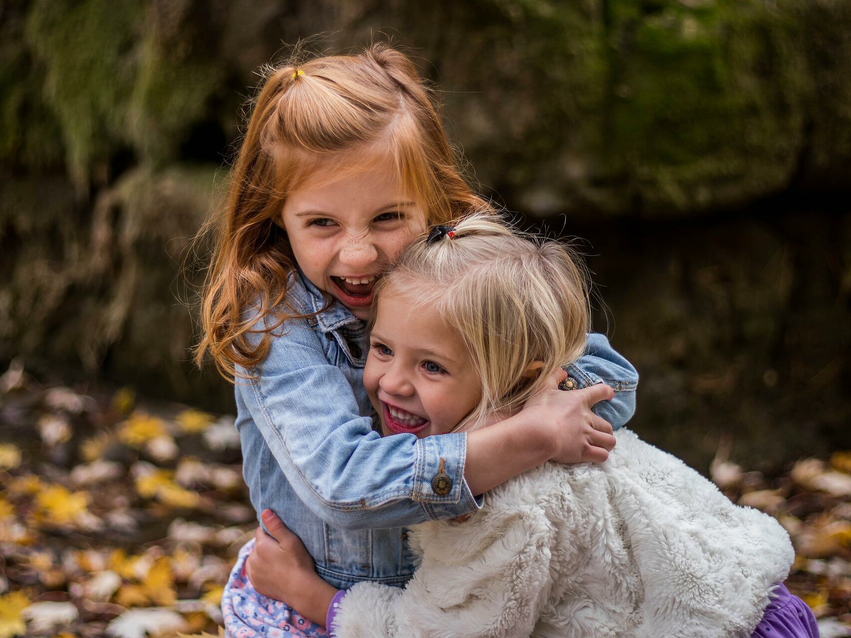 two young girls hugging